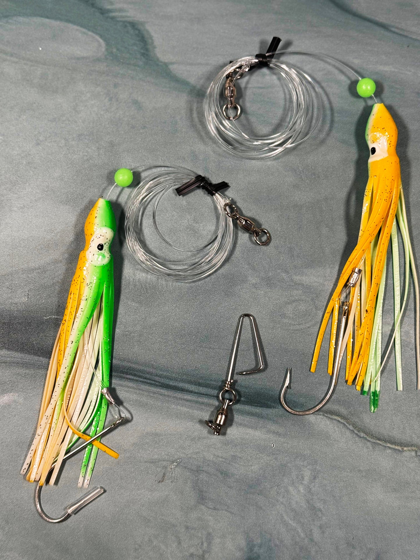 TAQL squid rig with green and yellow squid skirt for trolling and bottom fishing.