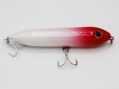 TAQL Skipper topwater lure in the classic red and white color combination.